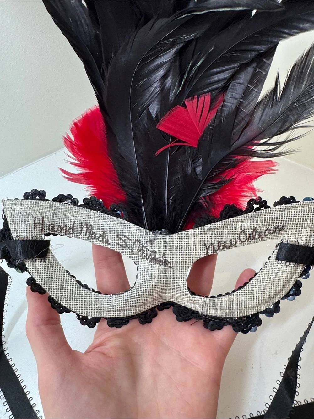 Handmade sequined and feathered mask from New Orleans.